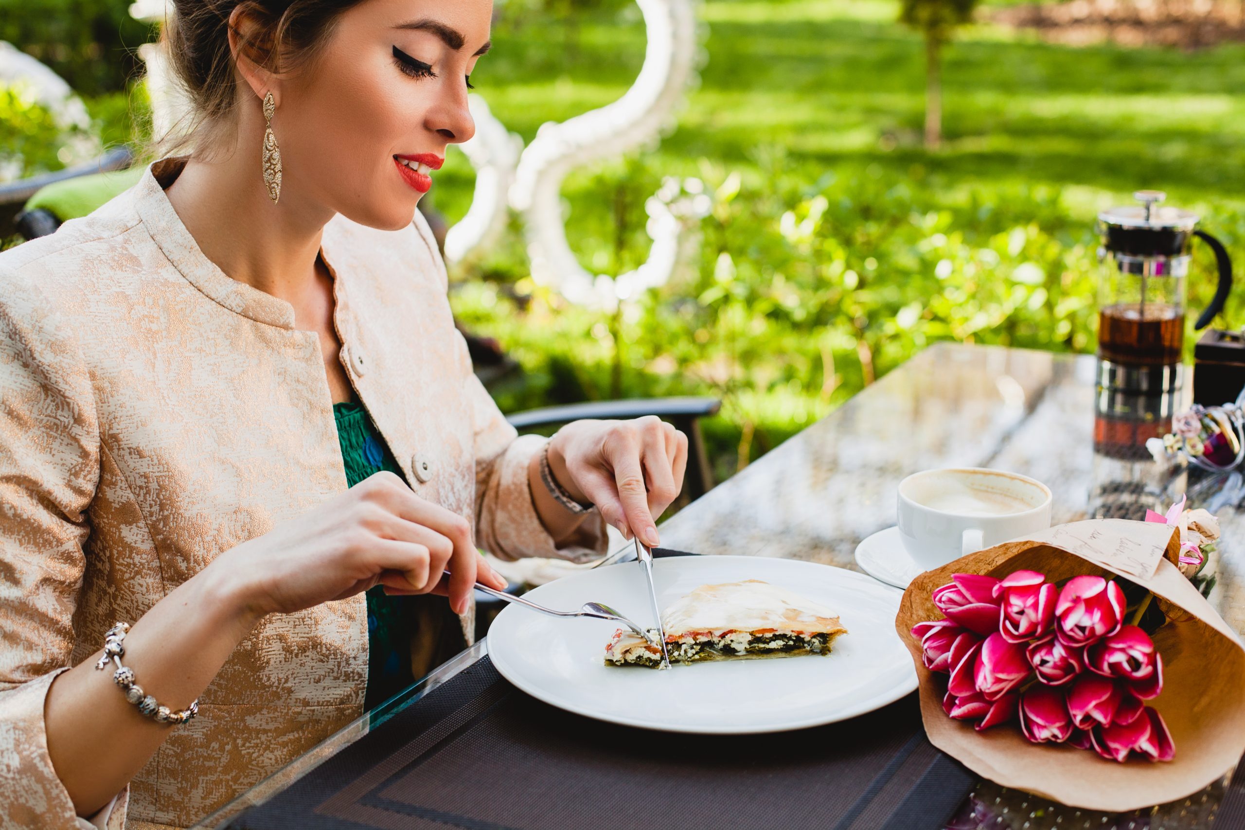 young stylish woman sitting cafe eating tasty pie scaled